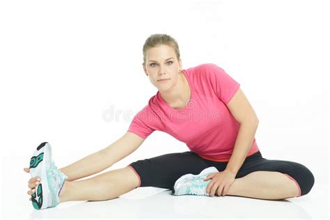 Young Caucasian Woman Stretching Legs Before Doing Her Workout Stock