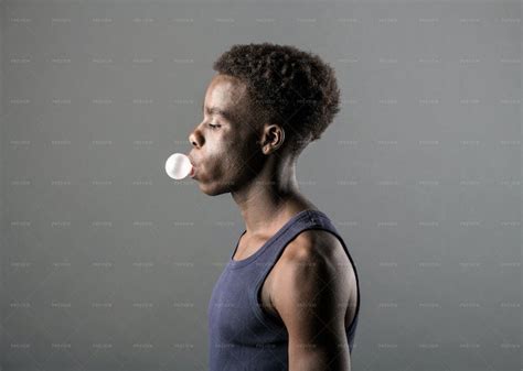 Young Man Blowing A Chewing Gum Stock Photos Motion Array
