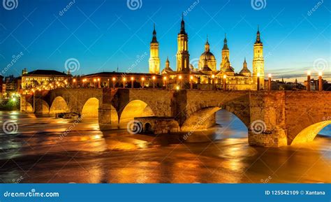 Zaragoza City Spain Bridge And Cathedral Del Pilar At Sunset Stock