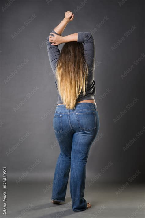 Plus Size Model In Blue Jeans Xxl Woman On Gray Studio Background