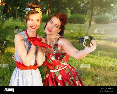 Two Girls Do A Photo At A Picnic In Retro Style Stock Photo Alamy