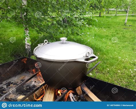 Fish Soup Boils In A Cauldron On An Open Fire Stock Photo Image Of