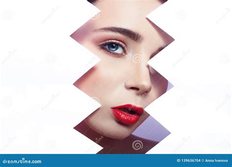 Woman Looks Into The Hole Of Torn Paper Bright Beautiful Makeup Big Eyes And Lips Bright