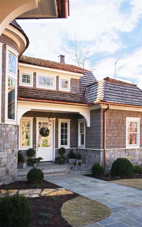 Eastern cedar shingles appropriately clad the cottage. Charming shingle style cottage on Lake Keowee, South Carolina