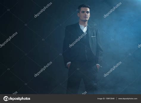 Gangster Wearing Suit Standing In Smoke Stock Photo By ©ysbrand 139812648