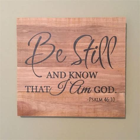 A Wooden Sign That Says Be Still And Know That I Am God