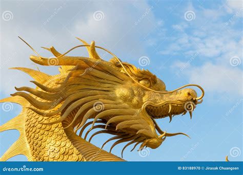 Chinese Golden Dragon Statue In The Background Of Blue Sky Stock Photo