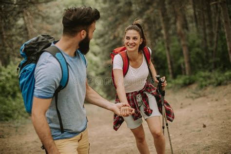 Young Couple Enjoying Hiking In Nature Stock Photo Image Of Mountain
