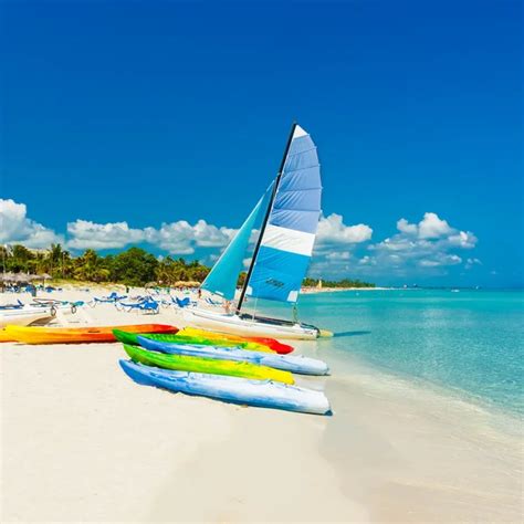 Boats For Rent At A Tropical Beach In Cuba — Stock Photo © Kmiragaya