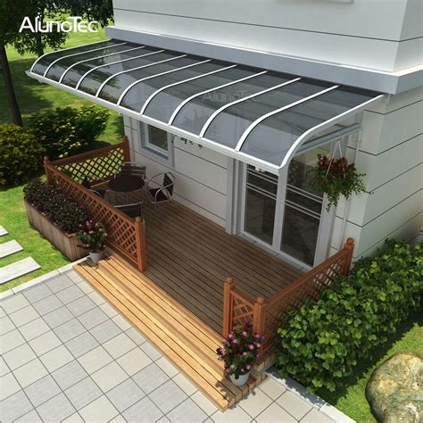 An Image Of A Deck With Plants And Flowers On The Front Porch In This