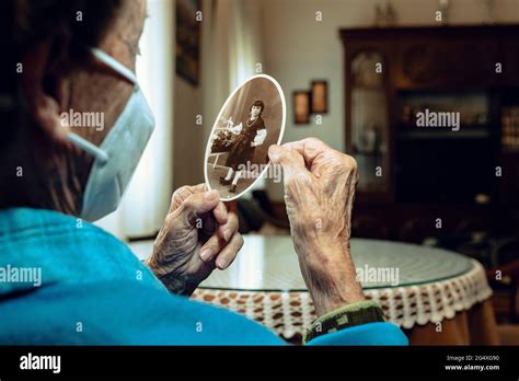 Senior Woman Remembering Childhood Memories At Home Stock Photo Alamy