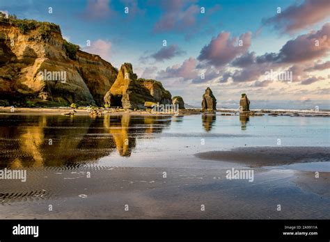 The Three Sisters Rock Formations At Low Tide At Tongaporutu Beach On