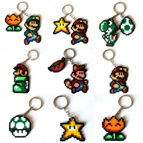 Six Different Key Chains With Mario Luigi And Other Characters On Them