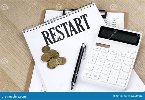 Restart Text On Notebook With Chart And Calculator And Coins Business