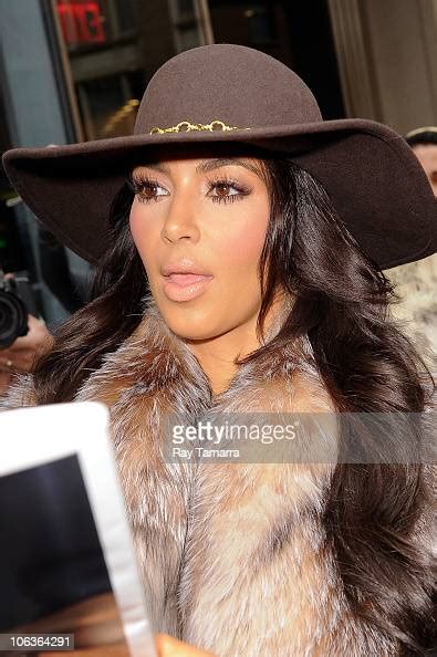 Tv Personality Kim Kardashian Signs Autographs For Fans At Her News