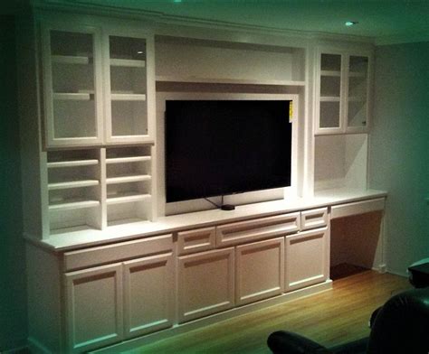 Custom Built In Wall Unit For Television Display And Desk Built In