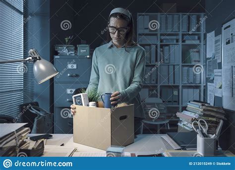 sad woman packing her belongings in the office stock image image of businesswoman indoors