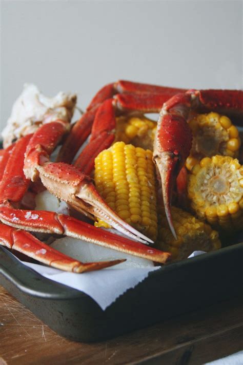 Add a pinch of salt to the water. Snow crab legs get boiled in Old Bay seasoning with corn ...