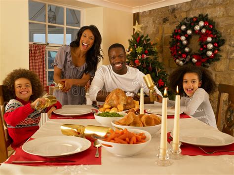 Family Having Christmas Dinner Stock Photo - Image of adult, inside