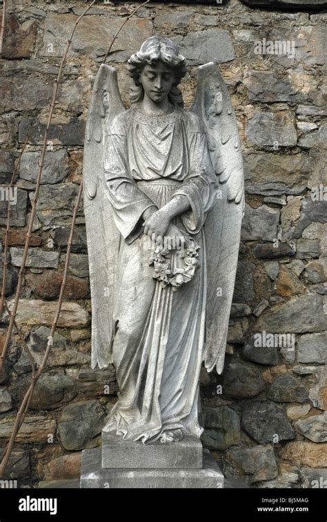 Statue Of An Angel Holding A Wreath In The Dean Cemetery Edinburgh
