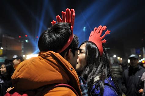 This Cute Couple Kissed In Their Festive Hats In Seoul South Korea New Years Eve Kisses