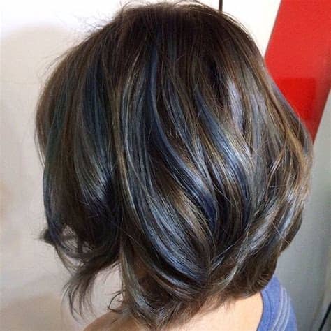 10 hairstyles that flatter a brown hair blue eyes combination. Layered brown bob with blue streaks | Blue hair highlights ...