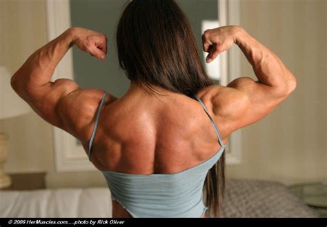 Strong fitness woman showing back biceps muscles. Pin de S G en Wendy McMaster | Perros