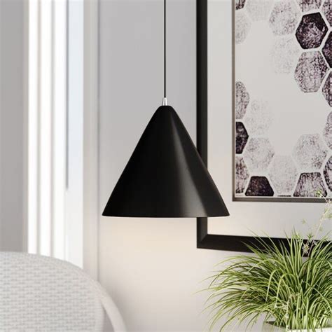 A Black Lamp Hanging From A Wall Next To A Potted Plant And Framed Art