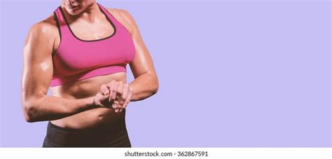 Muscular Woman Flexing Her Arm Against Stock Photo 362867591 Shutterstock