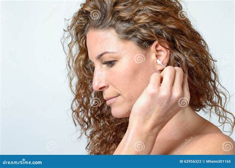 Woman Cleaning Her Ear With A Cotton Swab Stock Photo Image Of
