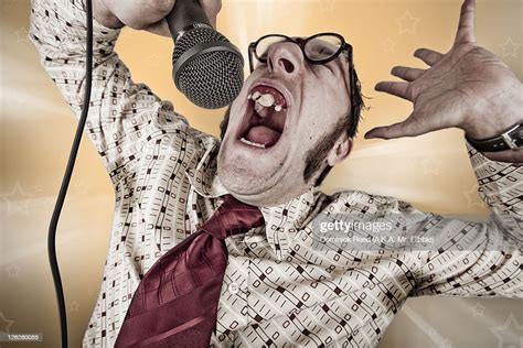 Man Singing Badly Into Microphone High Res Stock Photo Getty Images