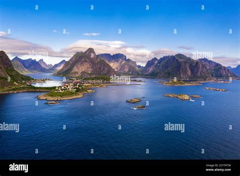 Reine Fishing Village Surrounded By High Mountains On Lofoten Islands