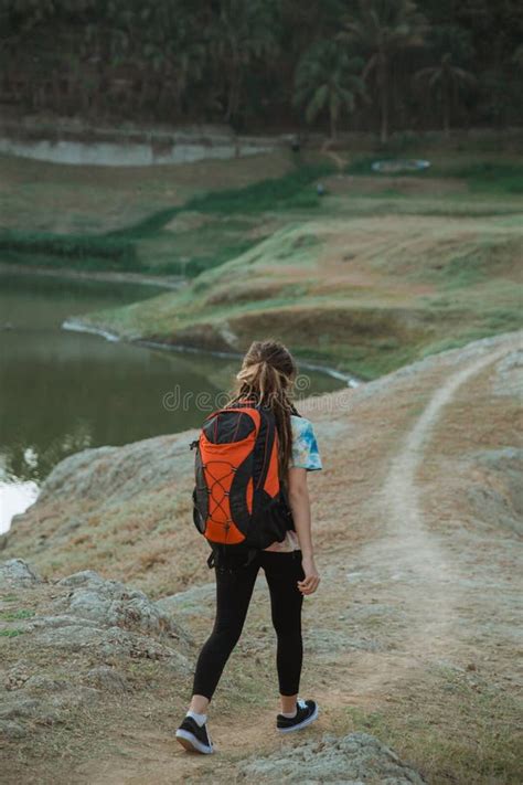 Woman Hiker Alone Enjoy The Beauty Of Nature Back View Stock Photo