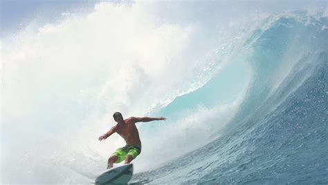 Slow Motion Cheerful Extreme Pro Surfer Surfing Big Tube Barrel Wave Teahupoo In Crystal Clear