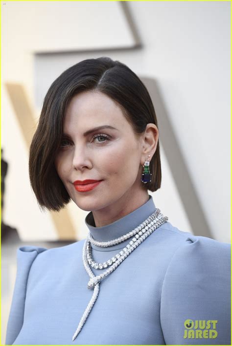 Charlize Theron Goes Backless Debuts New Hair On Oscars Red
