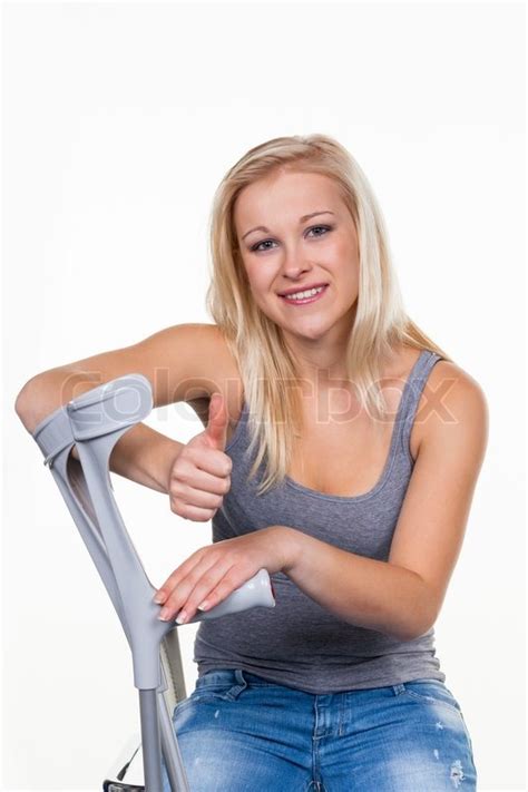 Woman With Crutches Stock Photo Colourbox
