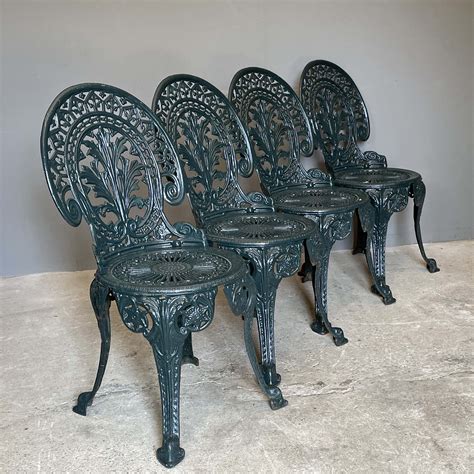 A Set Of Four Painted Cast Iron Garden Chairs Lassco Englands
