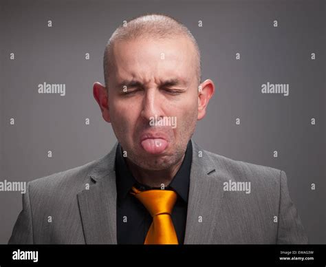 Business Man Sticking Out His Tongue With Closed Eyes Stock Photo Alamy