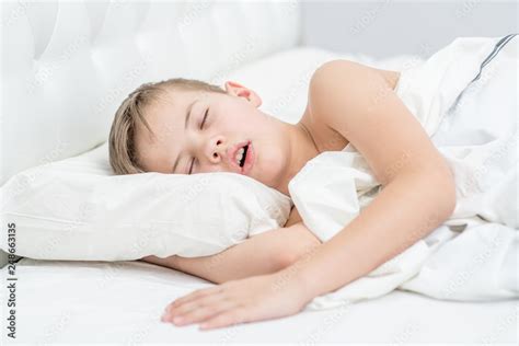 Little Boy Is Sleeping With His Mouth Open Snoring Stock Photo Adobe