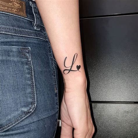 The tattoo i just got the letter t in cursive turns into a. 40 Letter L Tattoo Designs, Ideas and Templates - Tattoo ...