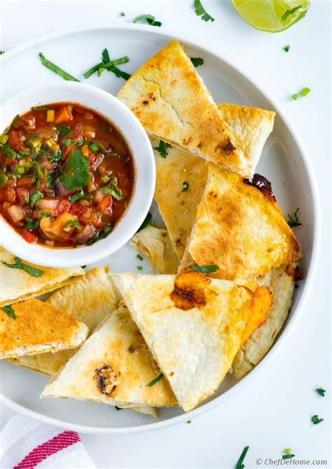 Preheat the oven and bake tortillas for 5 minutes at 390ºf or 200ºc in the middle rack of your oven. Cheesy Baked Tortilla Chips Recipe | ChefDeHome.com (With ...