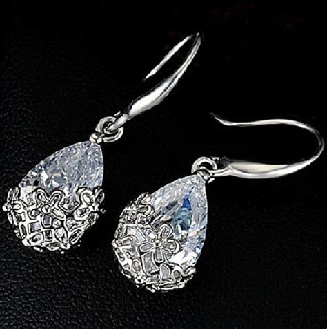 Shimmering Swarovski Crystal Drop Earrings Enrobed In A Sterling Silver