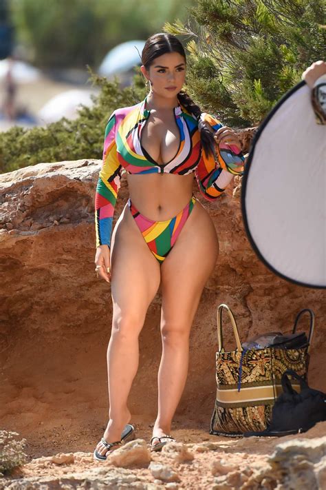 Demi Rose Stuns In A Colorful Bikini While Posing For A Beach