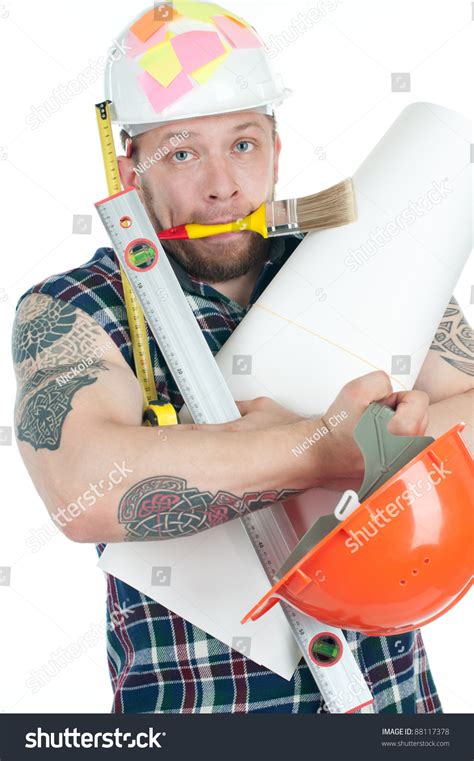 Puzzled Tattooed Caucasian Construction Worker With Various Working