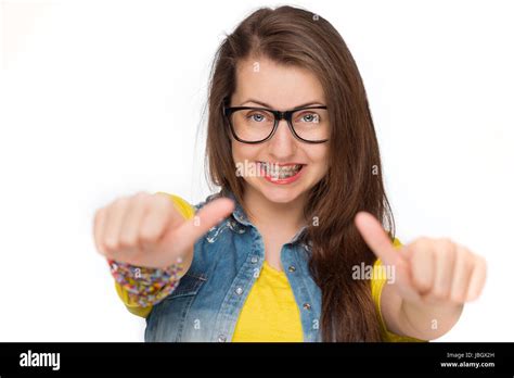 Girl In Braces Wearing Geek Glasses Showing Thumbs Up Isolated Stock
