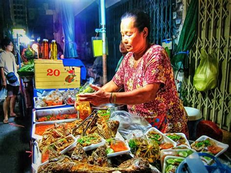 Vendor Preparing Enoki Bacon At Asian Street Food Market In Chiang Mai