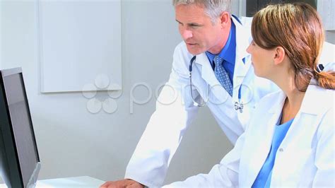 Caucasian Doctors Checking Medical Information Stock Footage Checking Doctors Caucasian Medical