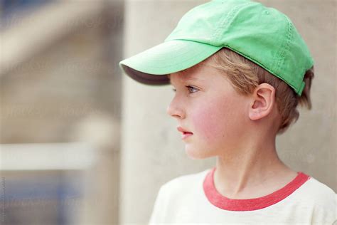 Portrait Of A Boy Wearing A Baseball Cap By Stocksy Contributor