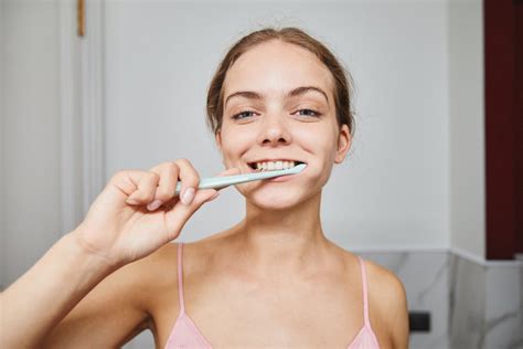 Close Up Shot Of A Woman Brushing Her Teeth · Free Stock Photo