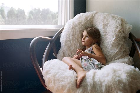 Girl Sitting Quietly In Chair by Maria Manco